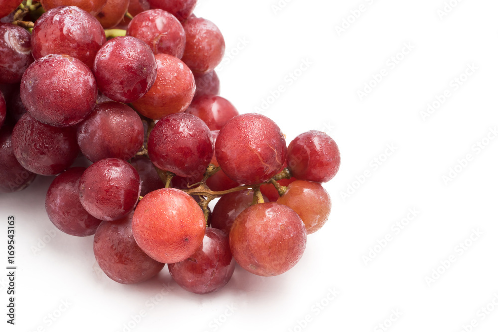 Red grapes on a white background.