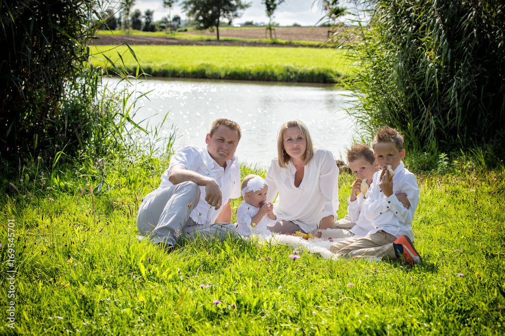 Family in white clothes, picnic in nature Family in white clothes, picnic in nature