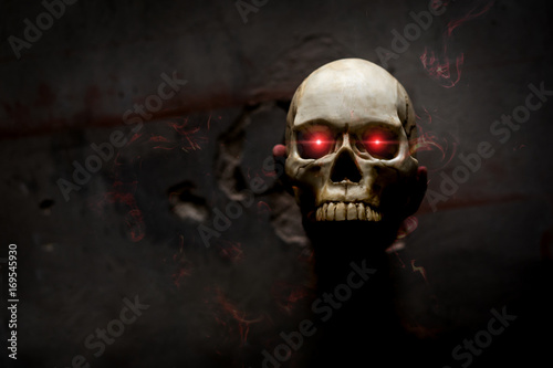 Fototapeta Hand death the ghost holding skull bone skeleton with Flame blood is screaming d