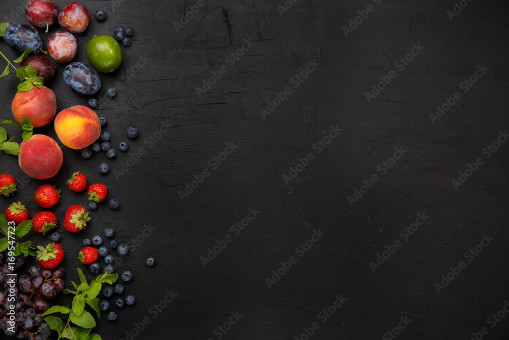 Fruits on the black rustic table. Top view.