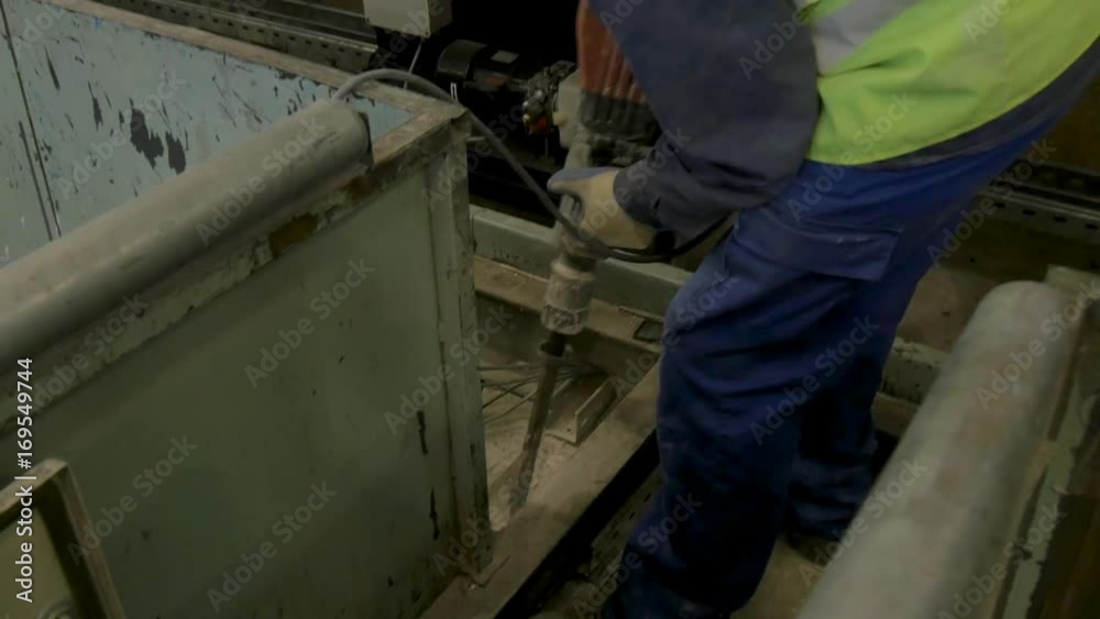 man working with pneumatic hammer man working with pneumatic hammer