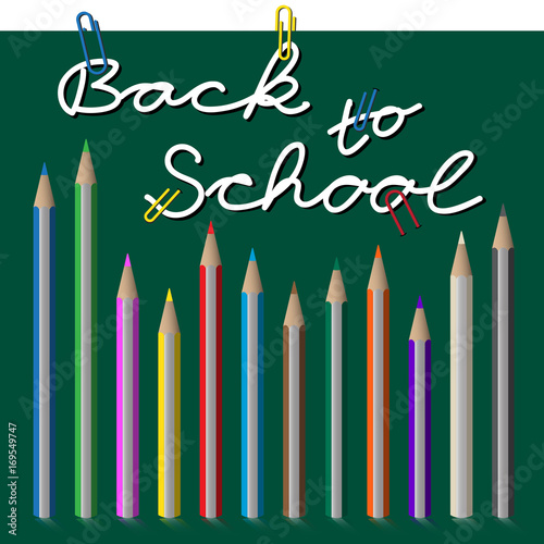 back to school, text with paper clip and pencils