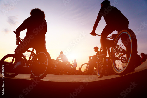 Fototapeta Naklejka Na Ścianę i Meble -  bicyclists on the ramp for jumping