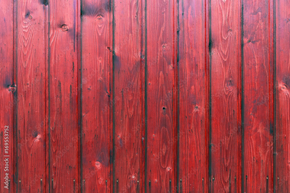The old red wood texture with natural patterns The old red wood texture with natural patterns