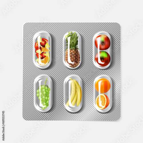 Blister pack of pills with fruit. Vitamins.