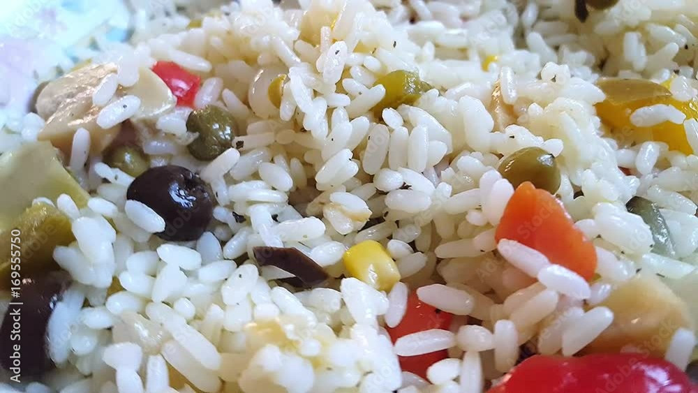 Close up of rice salad on turning plate