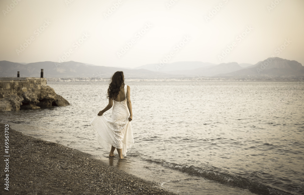 Girl standing on the beach with white dress retro photo Girl standing on the beach with white dress retro photo
