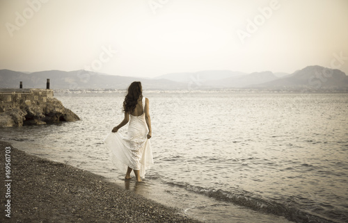 Girl standing on the beach with white dress retro photo © elgreko