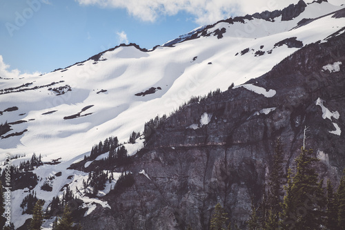 Snow covered ridge with trees in the foreground
