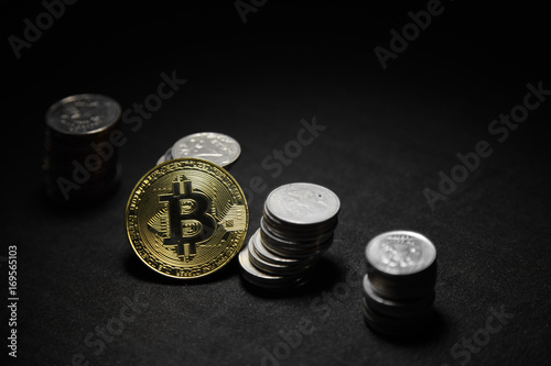 Golden bitcoin with money coins background. Bit coin cryptocurrency banking money transfer business technology photo
