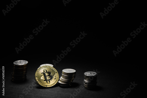 Golden bitcoin with money coins background. Bitcoin on black background photo
