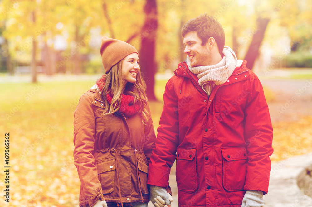 happy young couple walking in autumn park happy young couple walking in autumn park