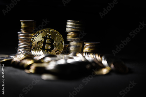 Golden bitcoin with money coins background. conceptual image for crypto currency. photo