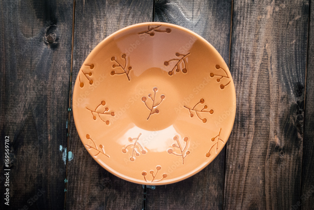 Empty bowl on a wooden background Empty bowl on a wooden background