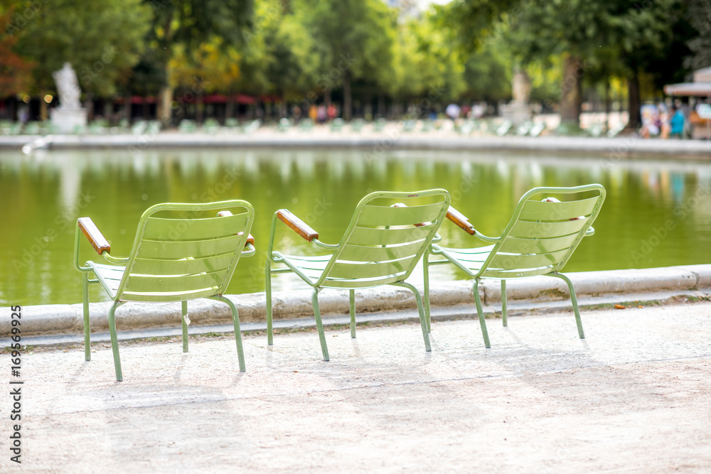 Famous green metal chairs at the Tuileries park in Paris Famous green metal chairs at the Tuileries park in Paris