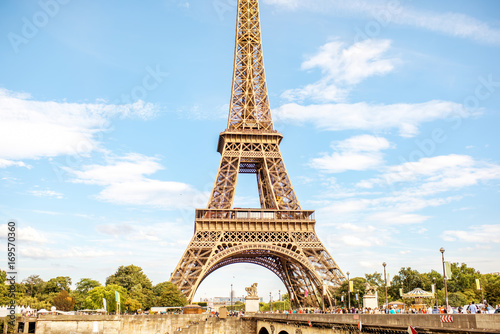 View on the famous Eiffel tower on the blue sky background in Paris