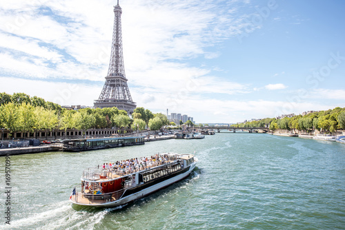 Landscpae view on the Eiffel tower and Seine river with tourist boat in Paris © rh2010