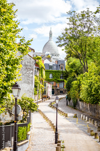 Cityscape view on the beautiful street with Sacred Heart cathedral on Monmartre hill in Paris © rh2010