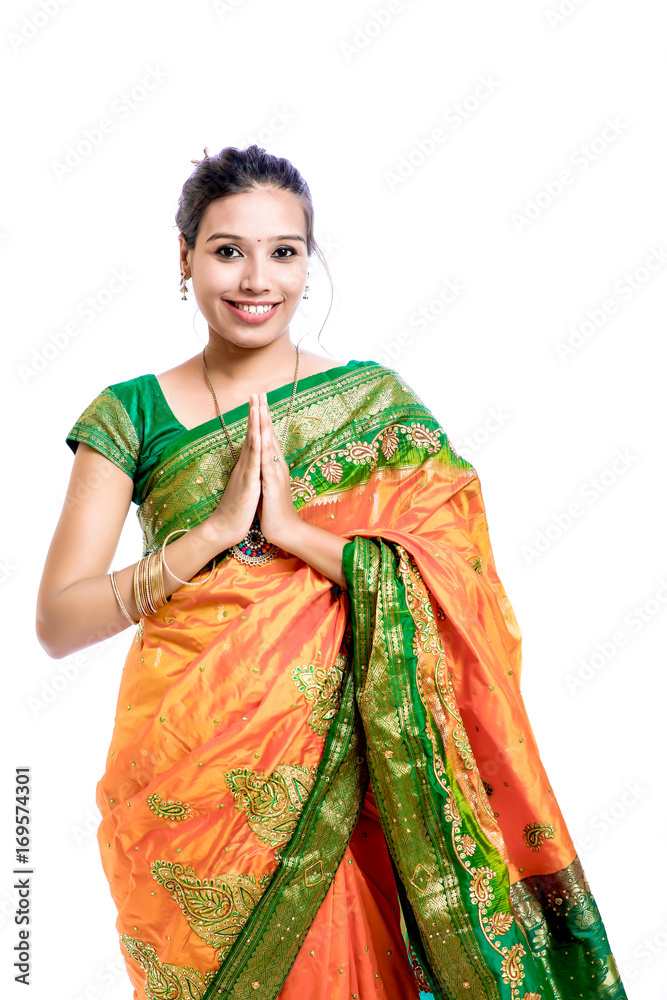 Happy young beautiful traditional Indian woman in traditional saree