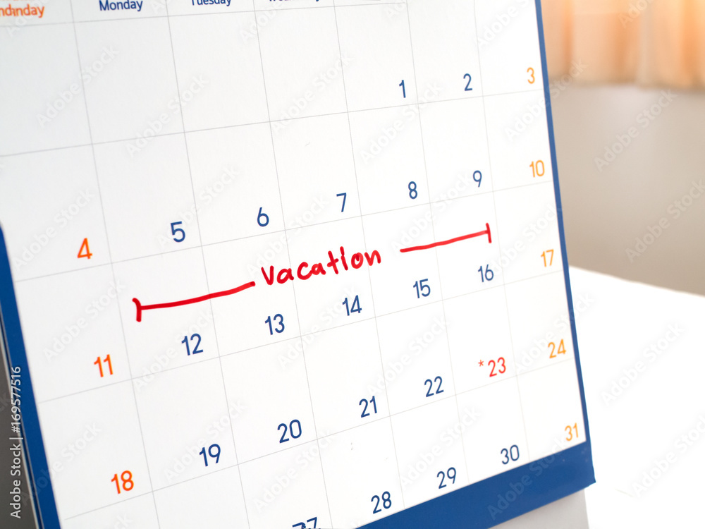 Red vacation write on white calendar marked for remember and target time to long  vacation and relax time. Stock Photo | Adobe Stock