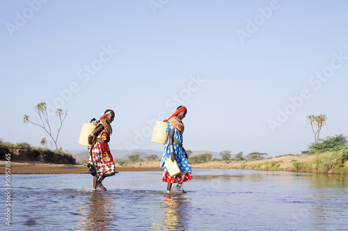 Samburu women collecting fresh water. Kenya, Africa.