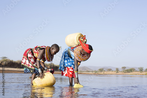 Samburu women collecting fresh water. Kenya, Africa.