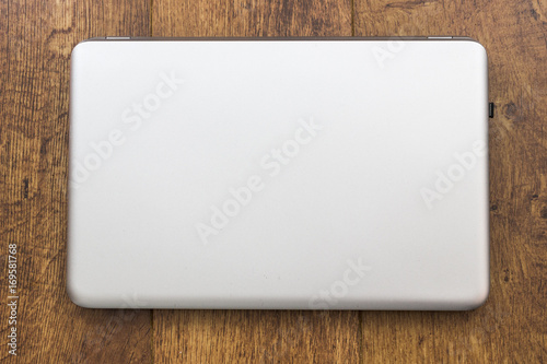 Silver laptop computer with lid closed