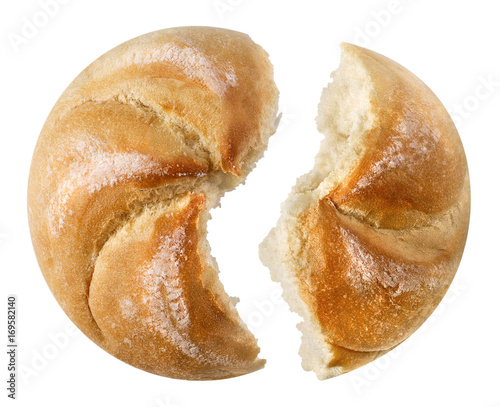 Two pieces of baked loaf of traditional austrian round bread 