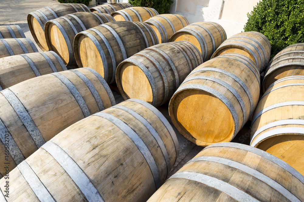 Wine barrels stacked in cellar