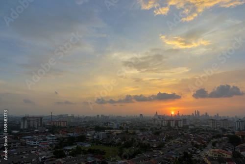 A majestic sunset in downtown Kuala Lumpur, the capital of Malaysia. Its modern skyline is dominated by the 451m tall KLCC, a pair of glass and steel clad skyscrapers.