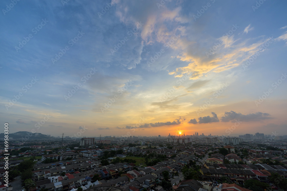 A majestic sunset in downtown Kuala Lumpur, the capital of Malaysia. Its modern skyline is dominated by the 451m tall KLCC, a pair of glass and steel clad skyscrapers.