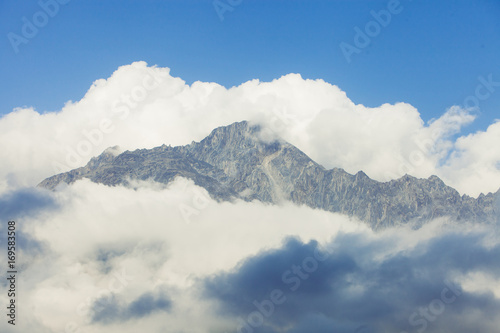 The peak of the mountain in the clouds