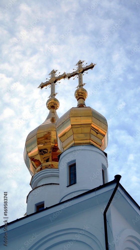 the Orthodox Church at sunset in winter in the field the Orthodox Church at sunset in winter in the field