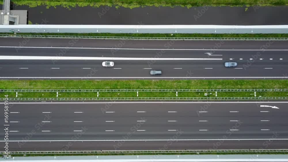 Empty streets, drone shot of highway, cars passing by Empty streets, drone shot of highway, cars passing by