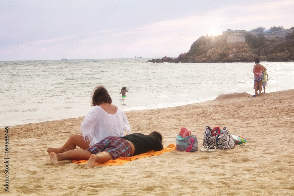 couple resting on the beach