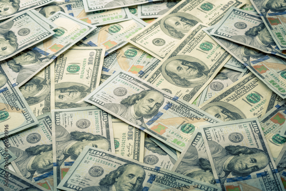 Lot of one hundred dollar bills close-up background Lot of one hundred dollar bills close-up background