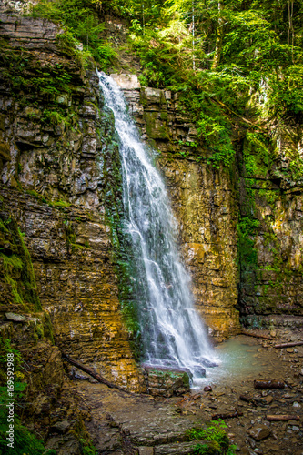 Fototapeta Naklejka Na Ścianę i Meble -  Photo of high waterfall in Carpathian mountains