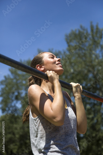 Young  brunette woman doing...