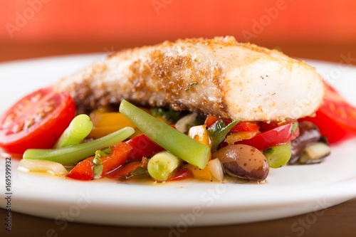 Fried fish with vegetable.