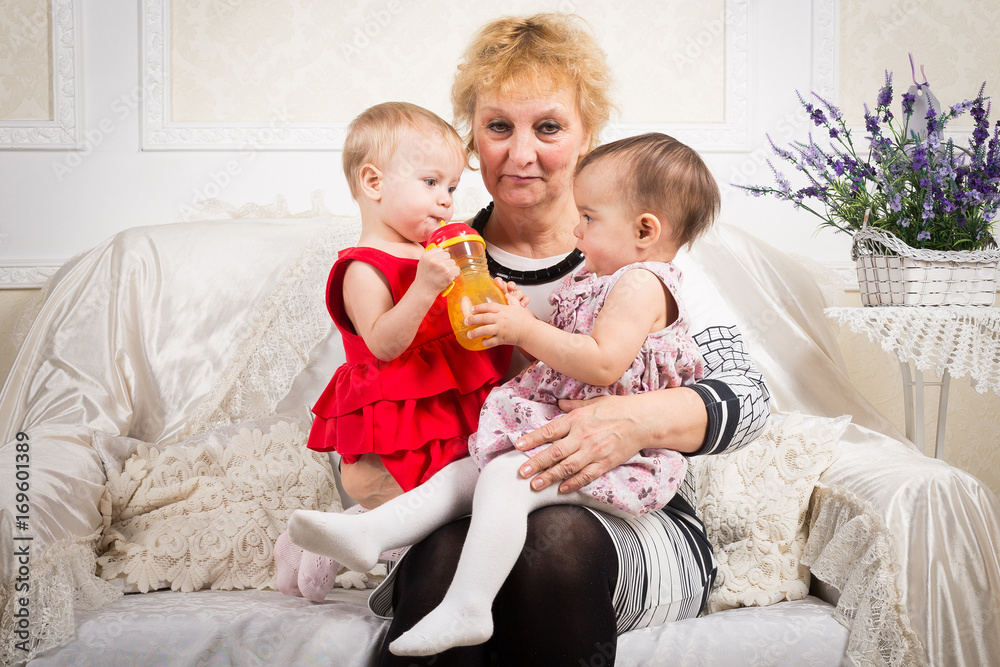 Grandmother and two granddaughters being happy and joyful Grandmother and two granddaughters being happy and joyful
