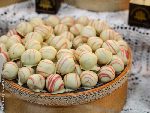 chocolate candies with filler lined in the display case photo