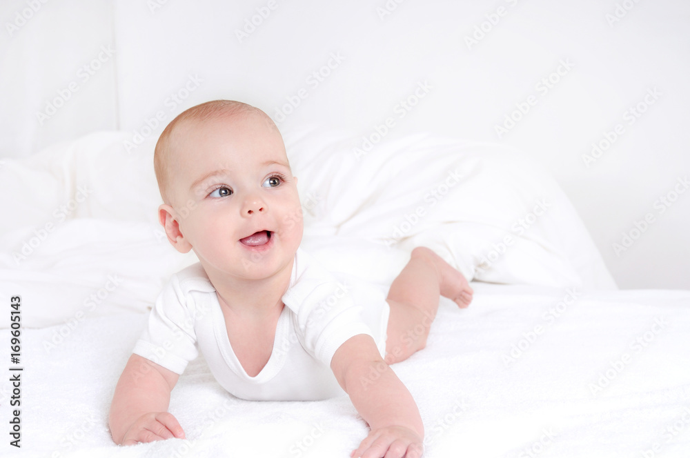 Infant child baby girl lying happy smiling on blanket Infant child baby girl lying happy smiling on blanket