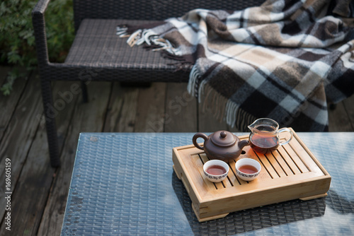 Traditional Chinese tea ceremony on the table in the courtyard of the house