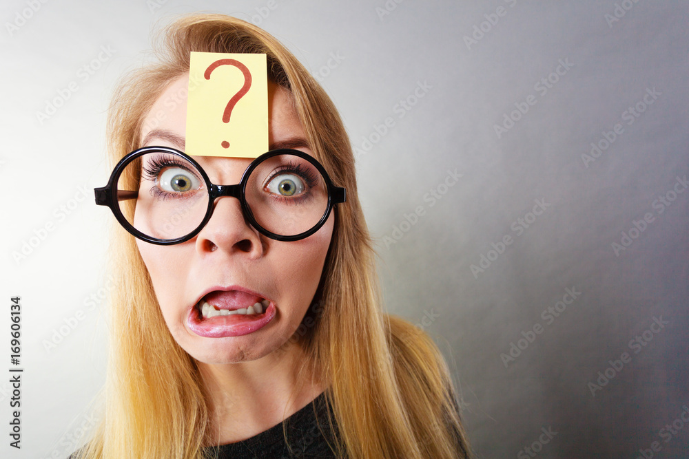 Weirdo nerd woman having question mark on forehead Weirdo nerd woman having question mark on forehead
