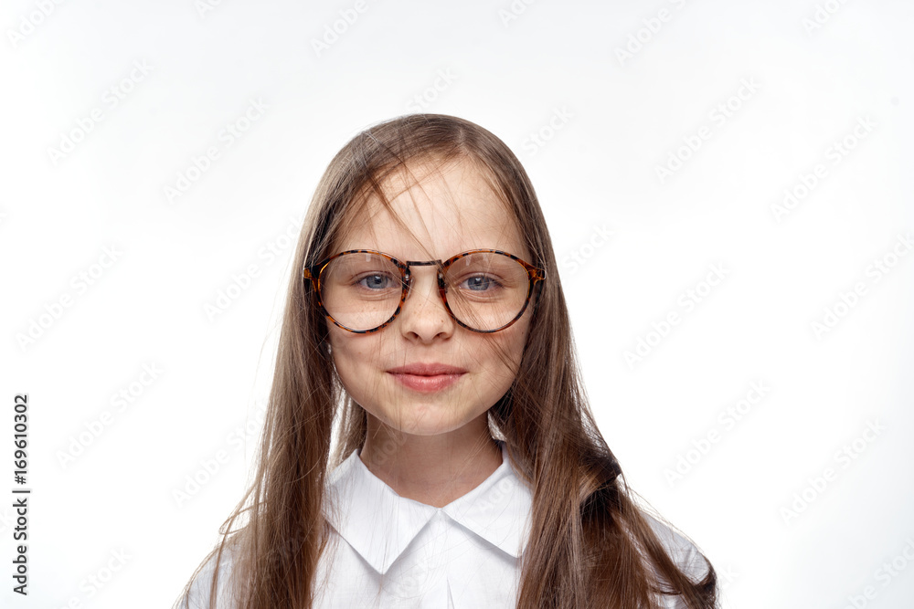 little girl with glasses on white isolated background, portrait