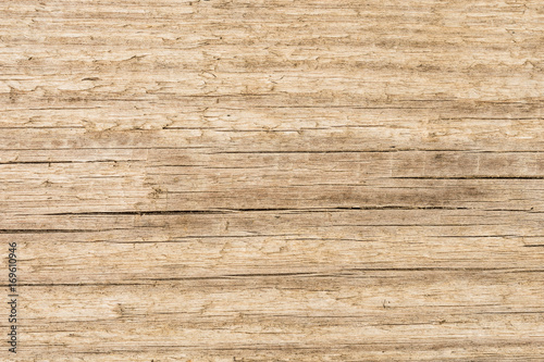 old wood texture background, structure of a natural untreated wooden surface with peeling fibers and cracks