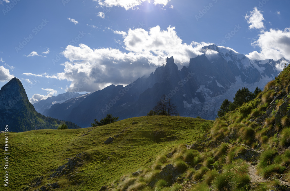 Mountain path overlooking Mont Blanc. Tour du Mont Blanc