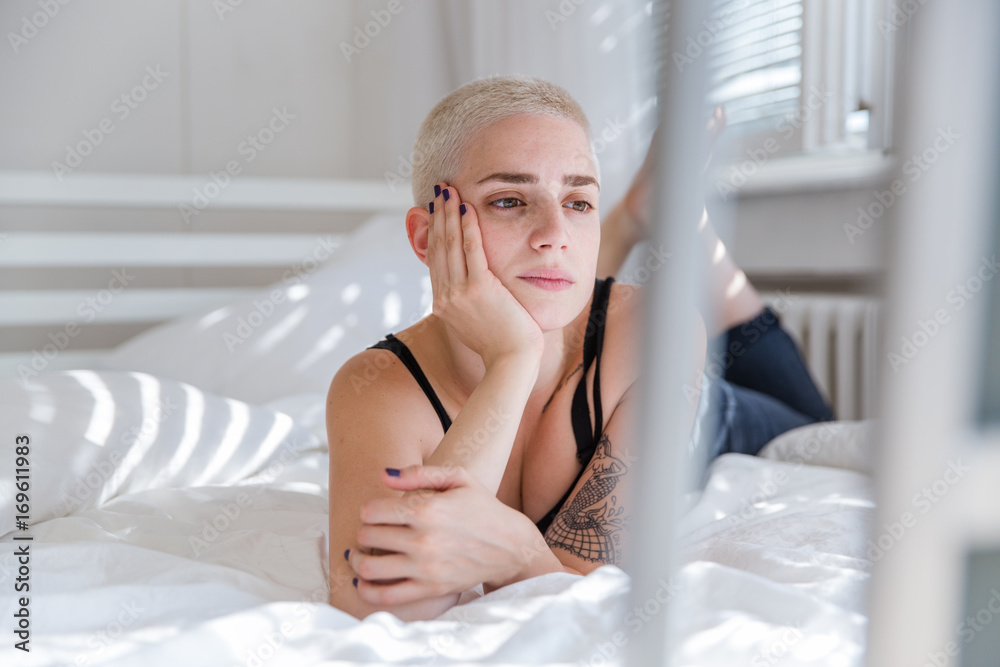 Portrait of a beautiful woman lying on bed Portrait of a beautiful woman lying on bed