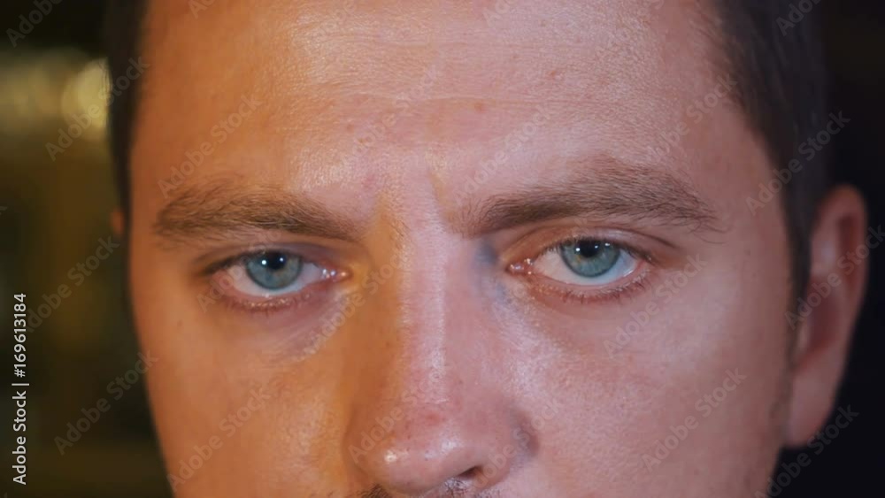 Close up of caucasian man blue eyes looking forward and from side to side. Shot with Sony a7s and Atomos Ninja Flame Close up of caucasian man blue eyes looking forward and from side to side. Shot with Sony a7s and Atomos Ninja Flame