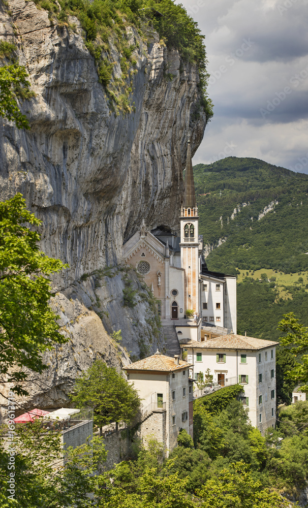 view to church under rock in Italy